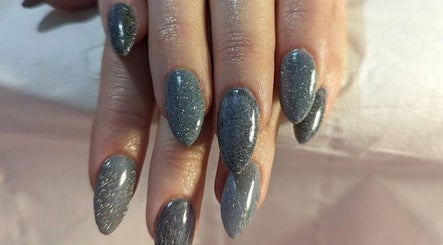 Elegant glitter nails at Andreas Hands and Tans in Stevenage, England, GB showcase sophisticated beauty.