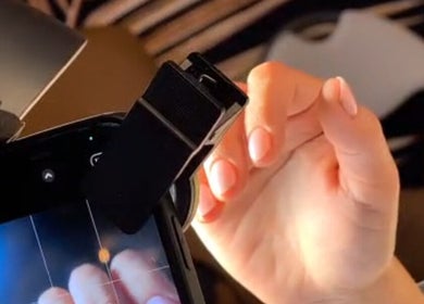 Close-up of a hand getting a manicure at Andreas Hands and Tans in Stevenage, England, GB.