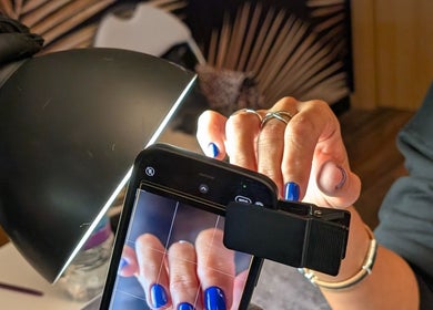 Nail art photography session at Andreas Hands and Tans, Stevenage, England, GB showcasing vibrant blue polish.