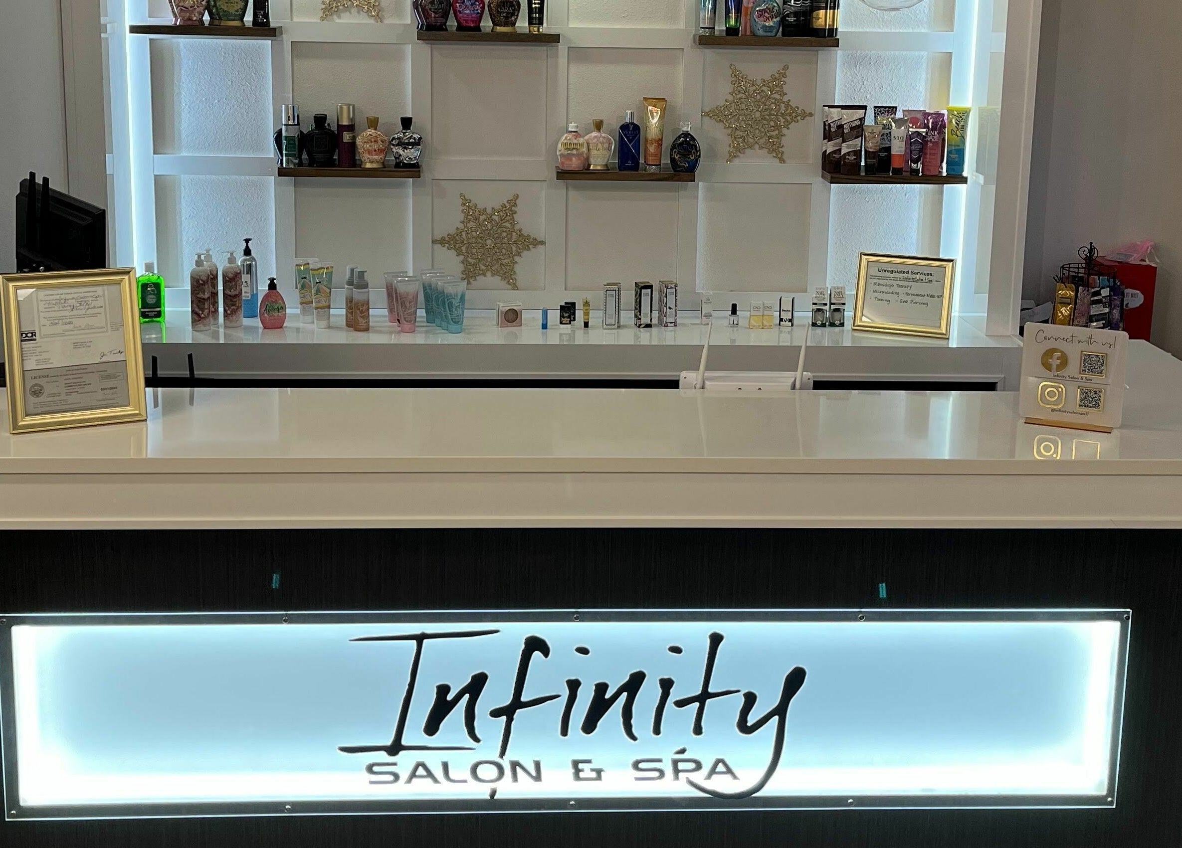 Reception area of Infinity Salon and Spa, Mitchell, South Dakota, US showcasing products and decor.