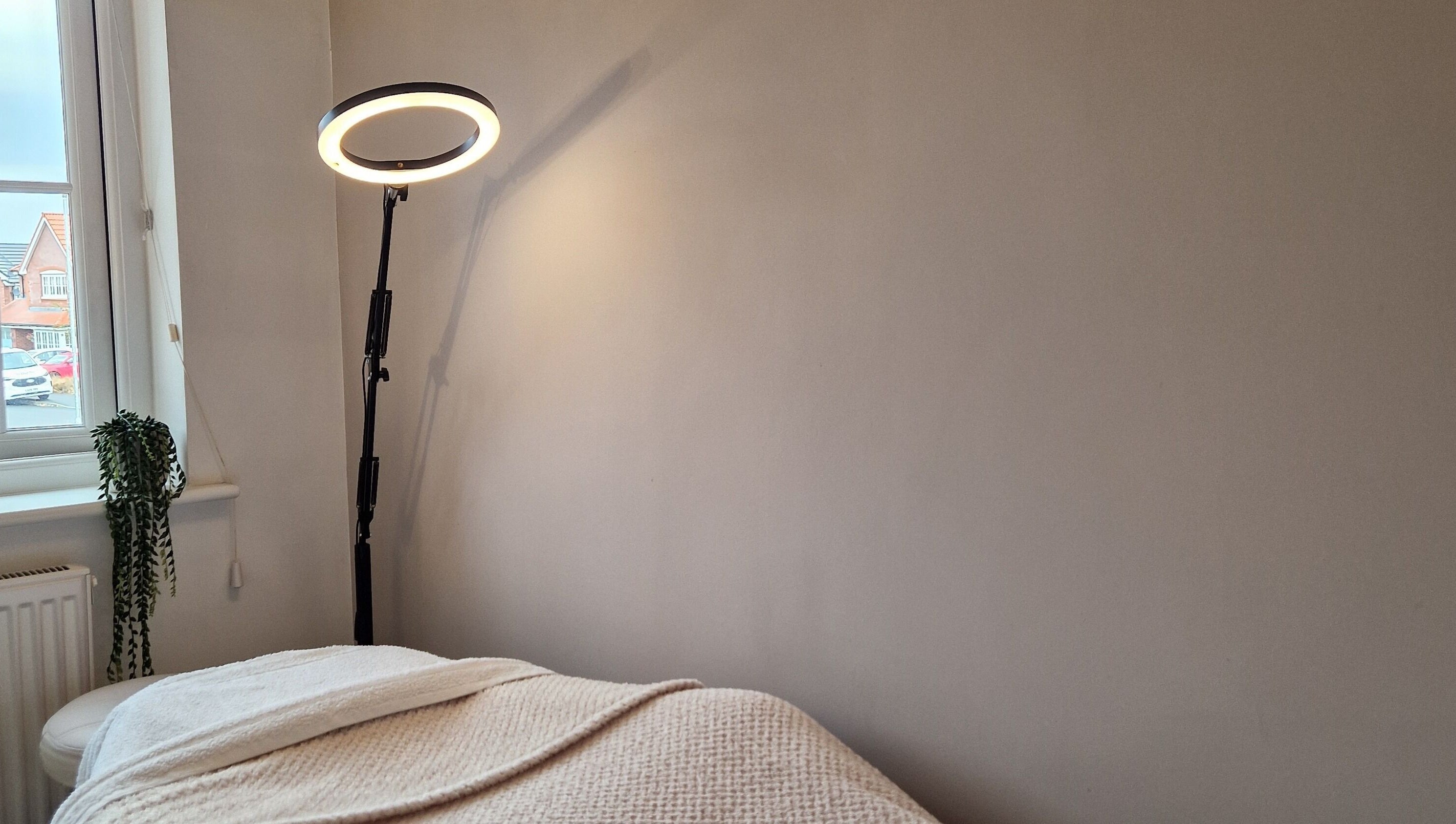 Cozy treatment room with soft lighting at Radiant Skin By KB, Rhyl, Wales, GB.