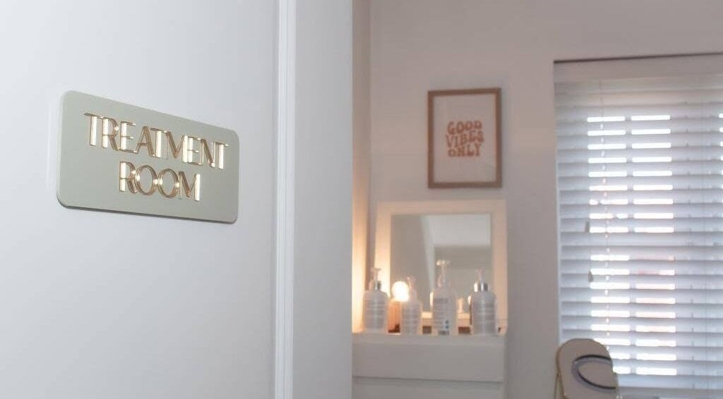 Treatment room at Radiant Skin By KB in Rhyl, Wales, GB with calming decor and skincare products.