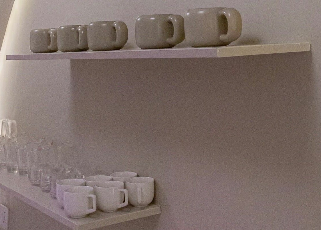Neatly arranged cups and glasses on shelves at Nuba Spa, Nairobi, Nairobi County, KE.