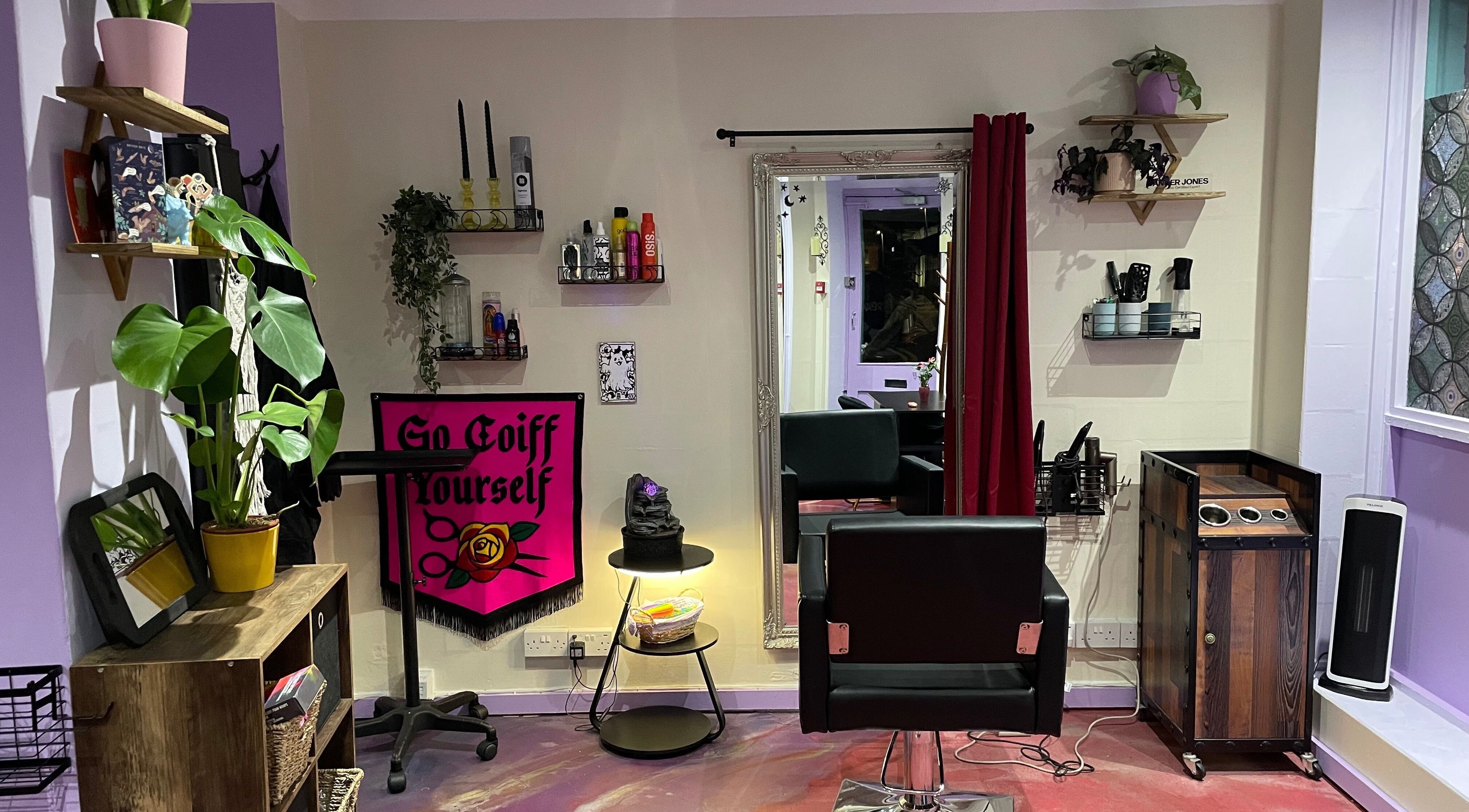 Modern salon interior at Go Coiff Yourself in Brighton And Hove, England, GB. Stylish decor with plants and seating.