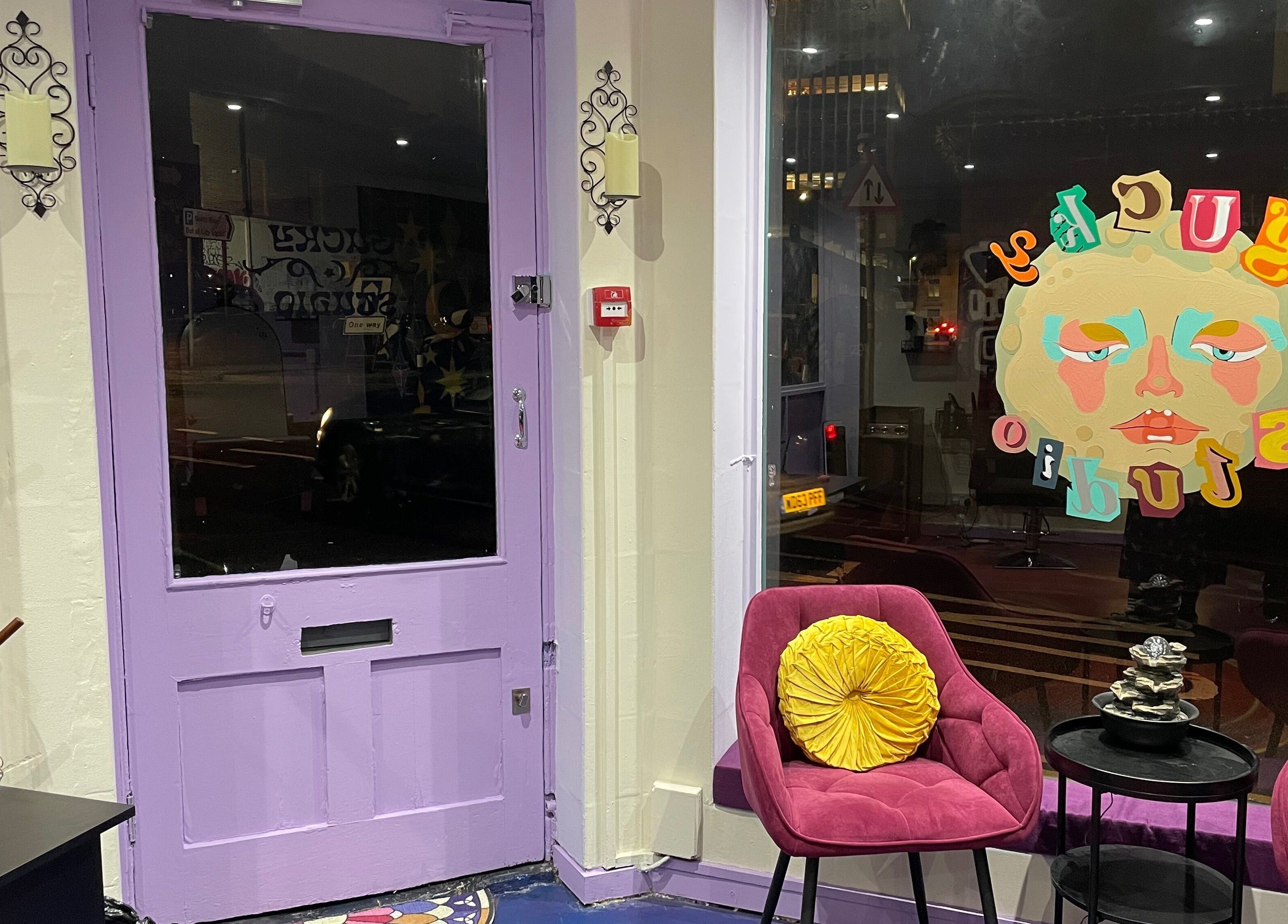 Chic salon entry with pink chairs at Go Coiff Yourself, Brighton And Hove, England, GB.