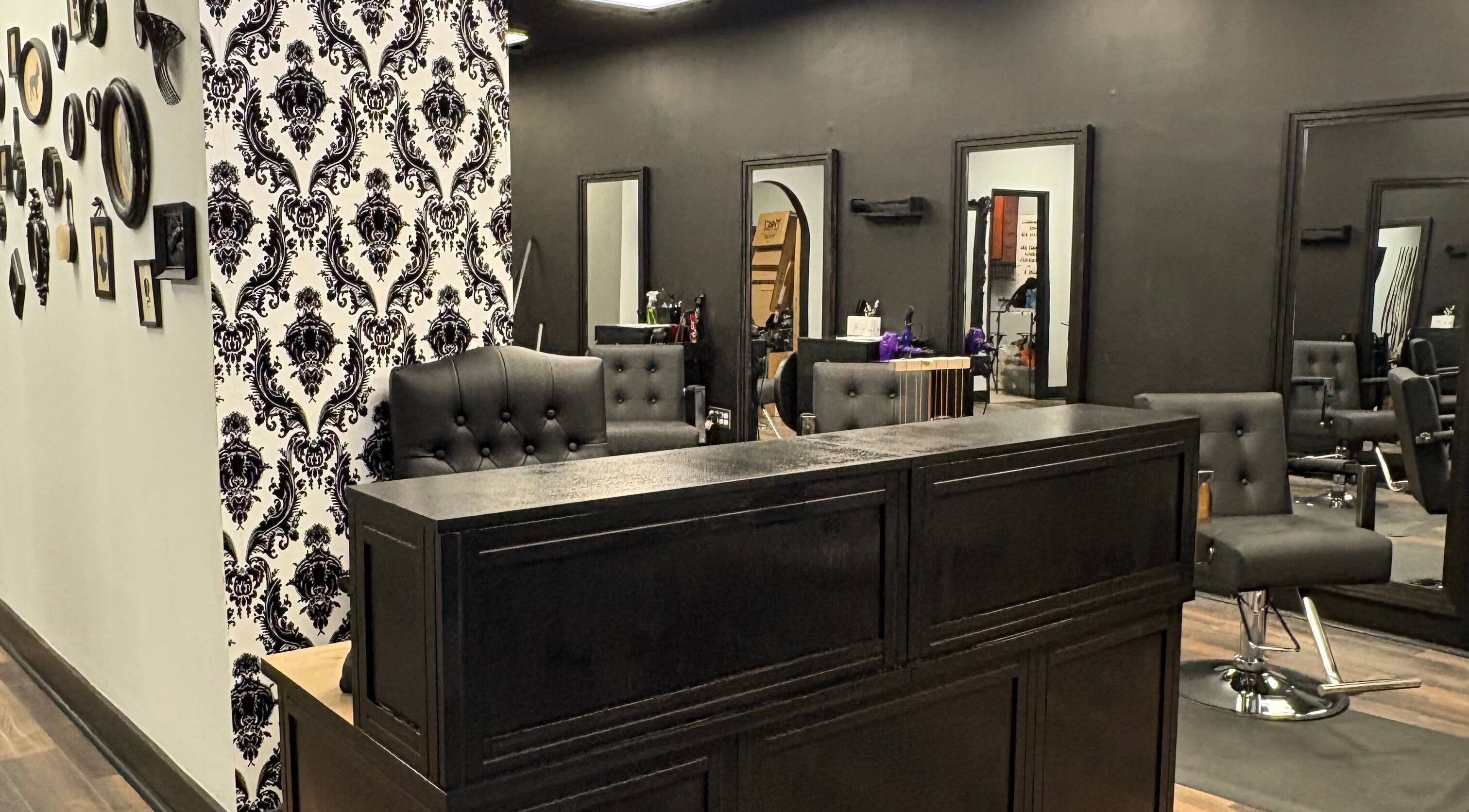 Chic interior of Salon Noir Hair Lounge in Dayton, Ohio, US, featuring modern black and white decor.