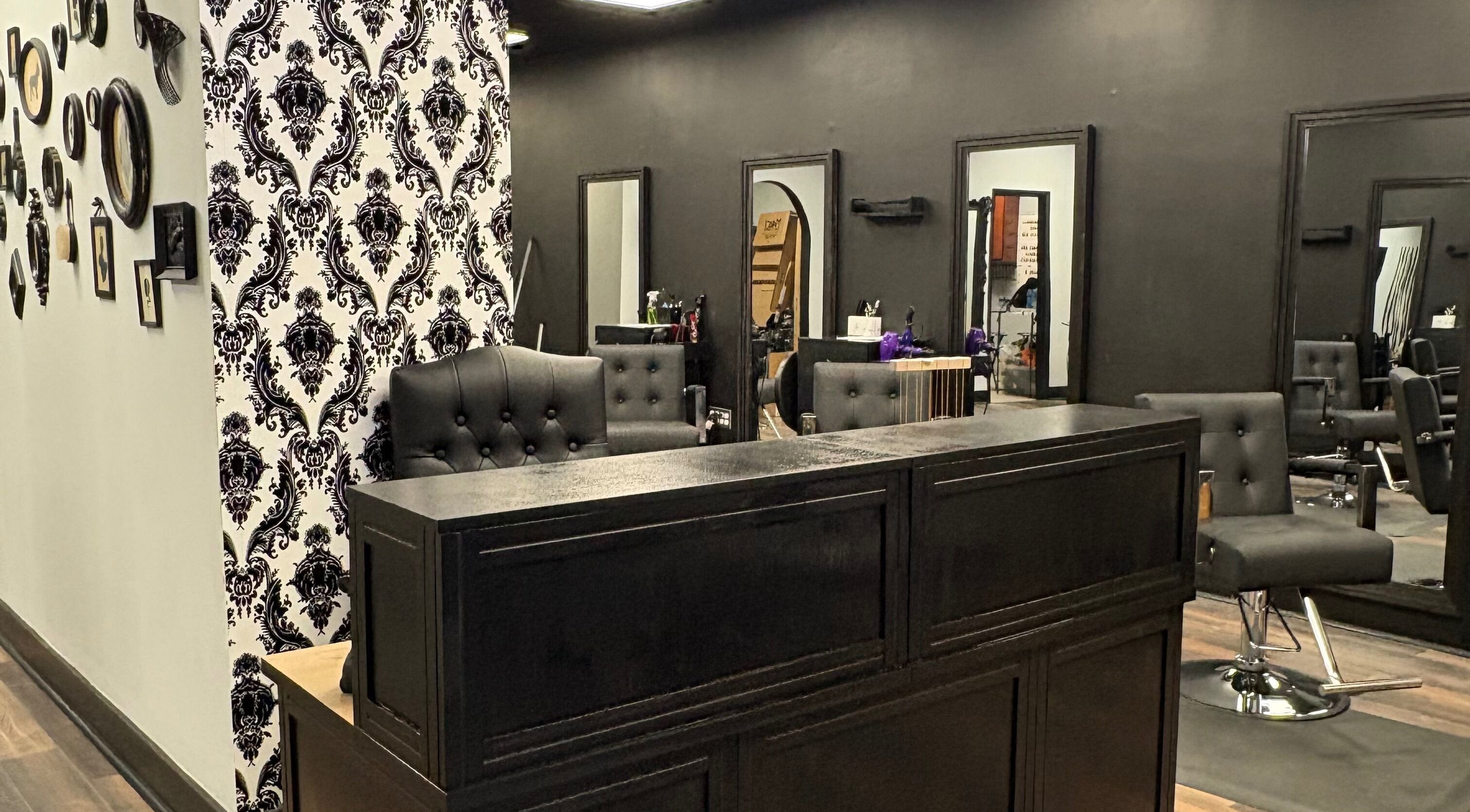 Chic interior of Salon Noir Hair Lounge in Dayton, Ohio, US, featuring modern black and white decor.
