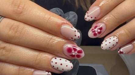 Elegant floral and dot nail art at Polished by Libs, Beckingham, England, GB. Perfect for stylish manicures.