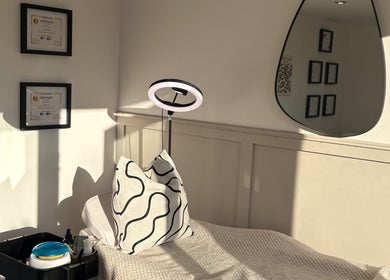 Relaxing treatment room at Polished by Libs, Beckingham, England, GB with cozy blanket and aesthetic decor.