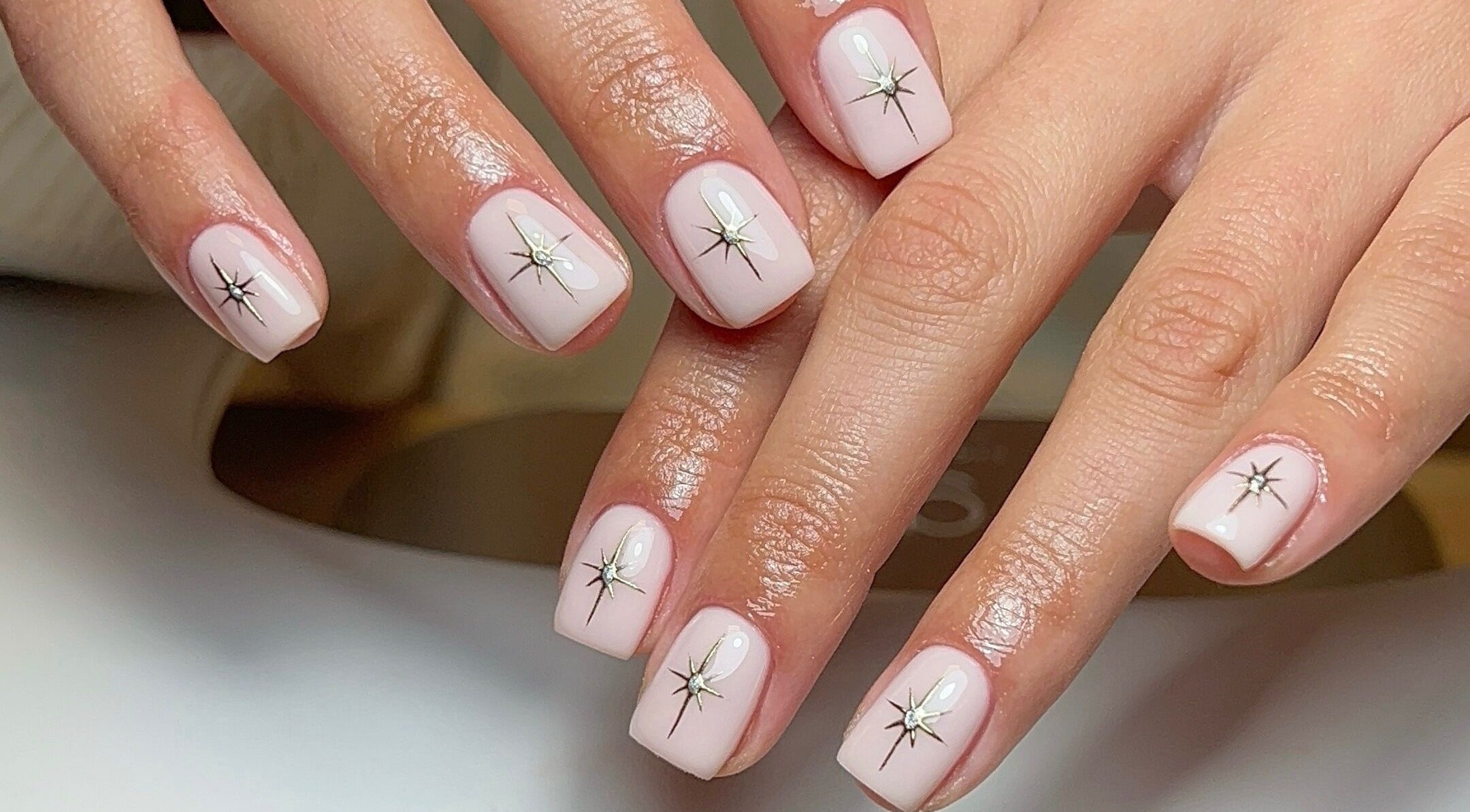 Elegant starry nail art at Coco Nail Studio, Cardiff, Wales, GB. Perfect blend of beauty and style.