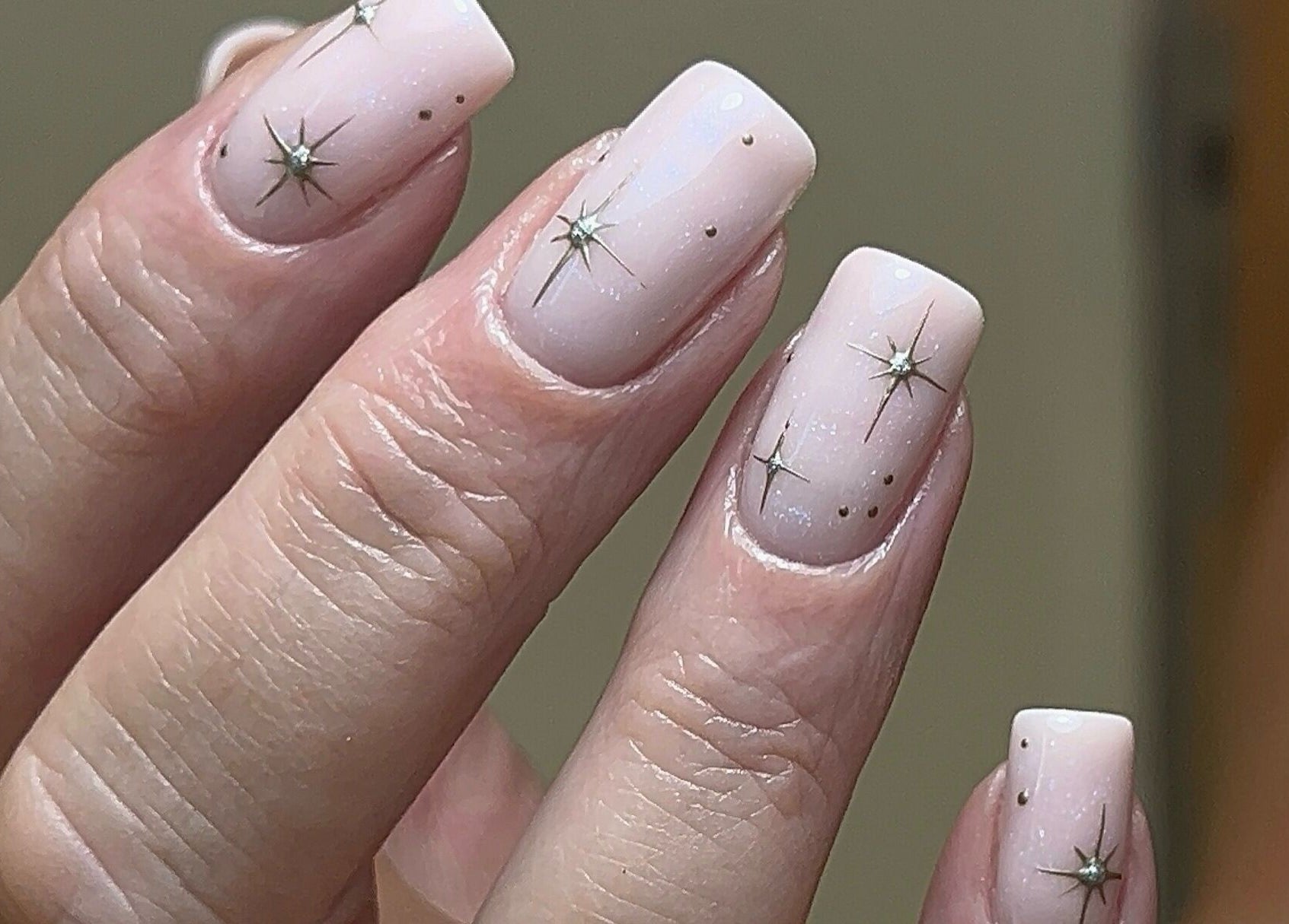 Elegant starry nail art at Coco Nail Studio, Cardiff, Wales, GB. Perfectly polished for a shimmering finish.