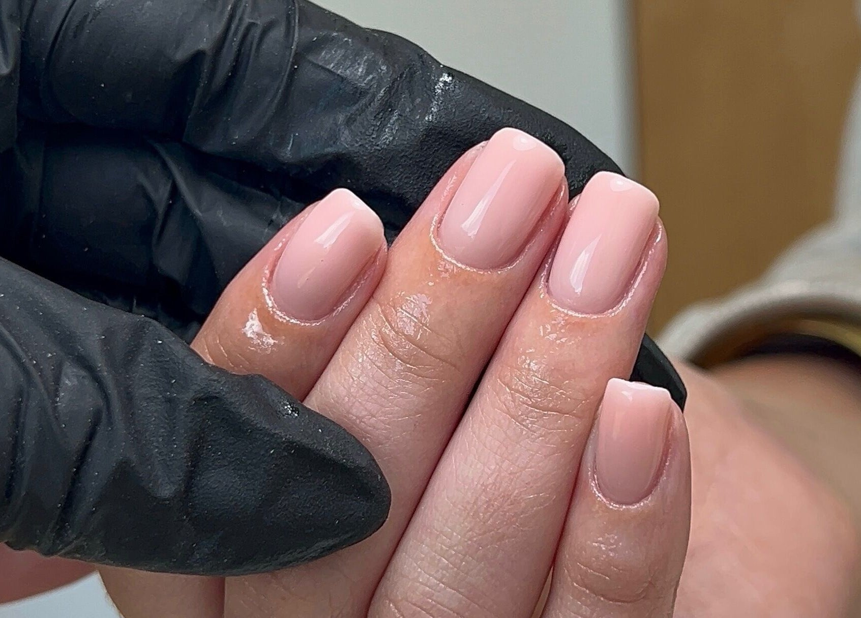 Manicured hands with nude polish at Coco Nail Studio, Cardiff, Wales, GB