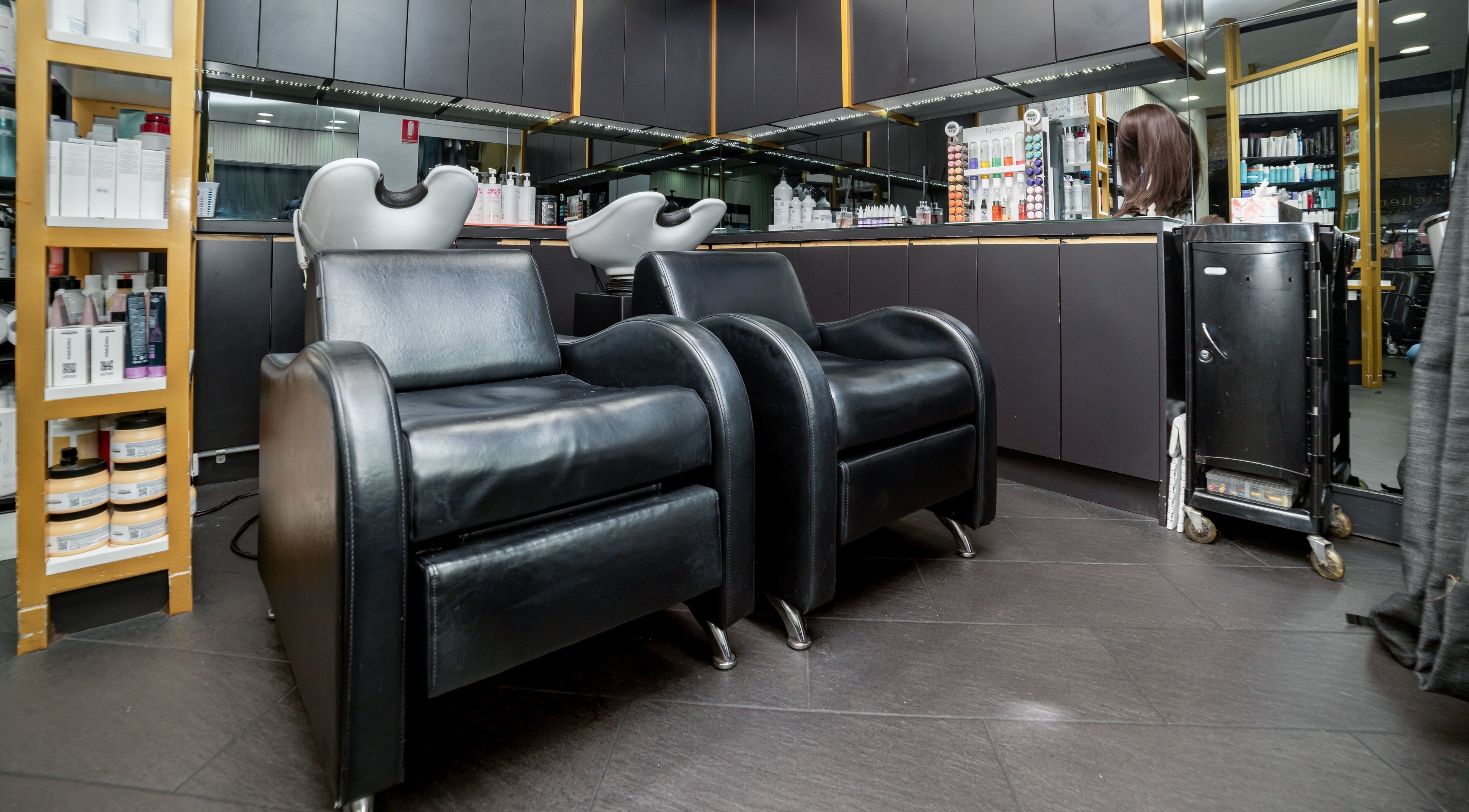 Modern black salon chairs at Bondi Hair Salon, Bondi Junction, NSW, AU ready for clients.