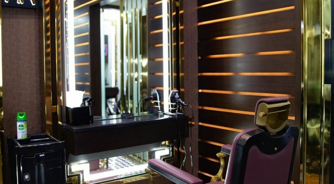 Elegant barber chair at Amber Gents Aykon City, Dubai, Dubai, AE with modern styling area.