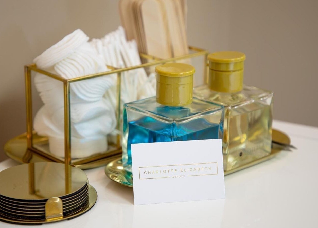 Beauty essentials at Charlotte Elizabeth, Assington, England, GB. Featuring lotions and cotton pads.