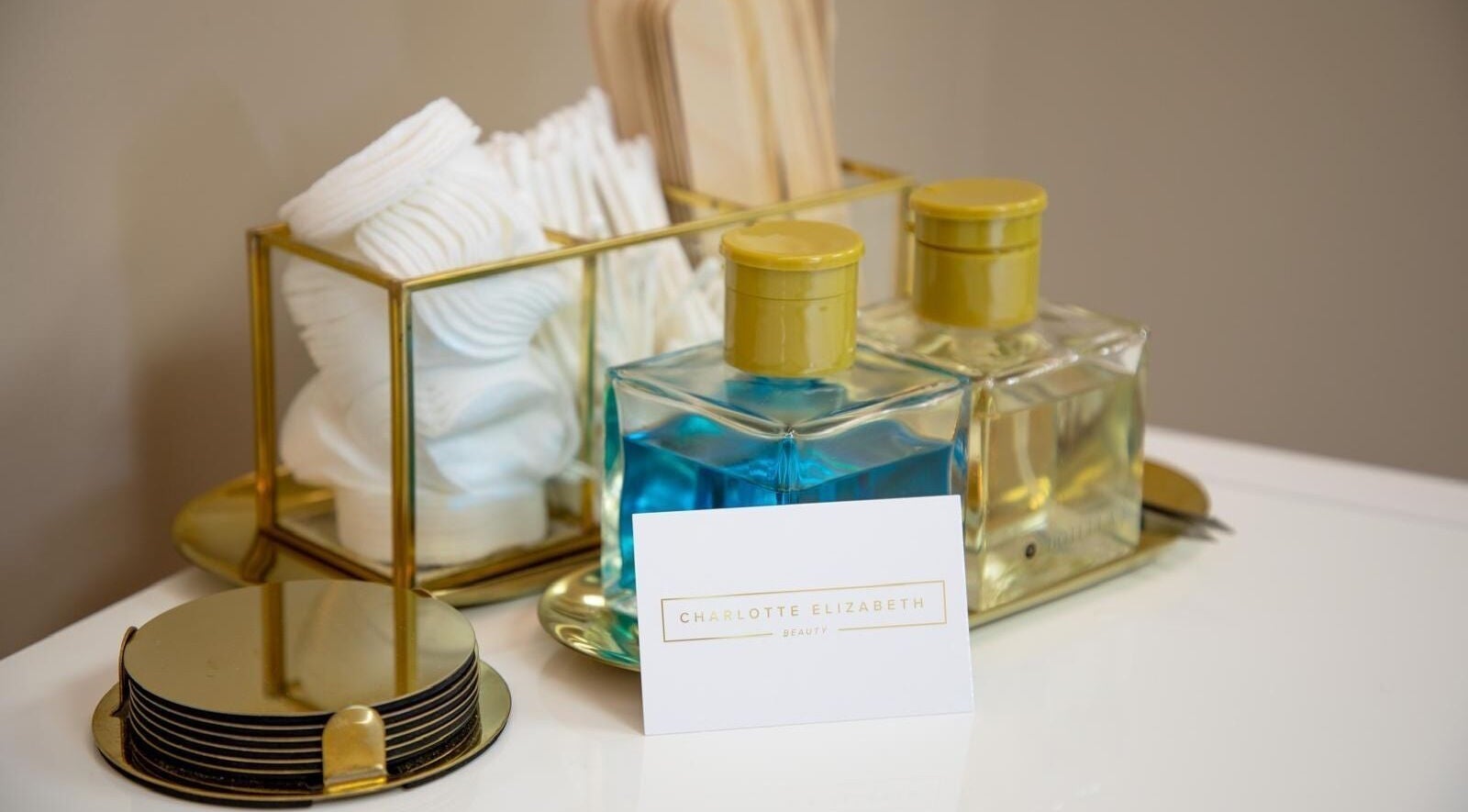 Beauty essentials at Charlotte Elizabeth, Assington, England, GB. Featuring lotions and cotton pads.