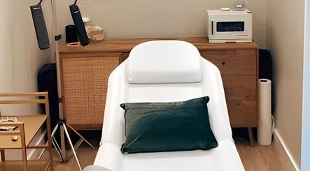 Relaxing treatment room at Stellar Beauty, Wimborne, England, GB with a sleek spa bed and calming ambiance.