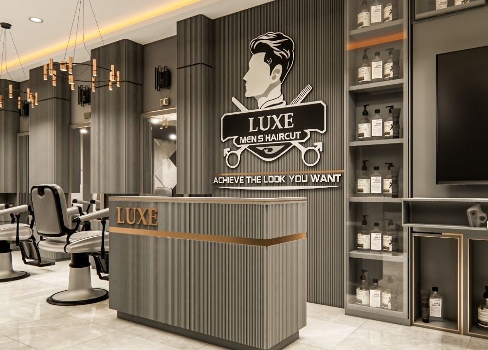Elegant interior of Luxe Gentlemen Salon in Mardan, Khyber Pakhtunkhwa, PK, with modern barber chairs and stylish decor.