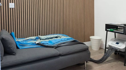 Relaxing cryotherapy room at Cryo Revive Manchester, featuring a therapeutic bed and equipment. Located in Manchester, England, GB.