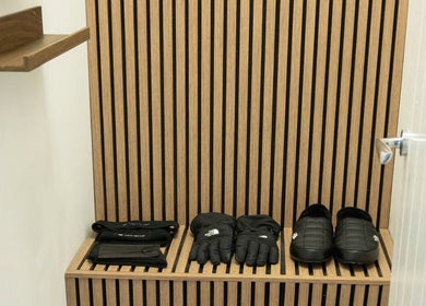 Winter gear set on wooden bench at Cryo Revive Manchester, Manchester, England, GB.