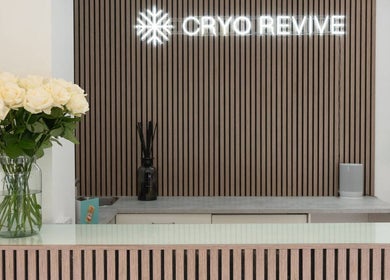 Reception desk at Cryo Revive Manchester with white roses, located in Manchester, England, GB.
