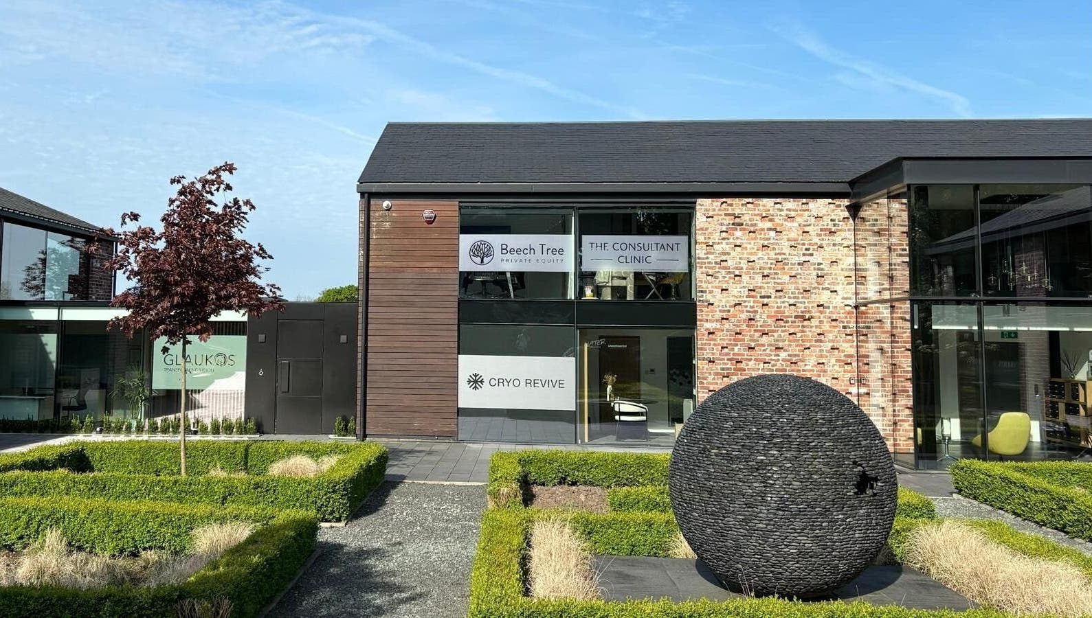 Entrance of Cryo Revive Wilmslow, a modern wellness center in Wilmslow, England, GB, showcasing contemporary architecture.