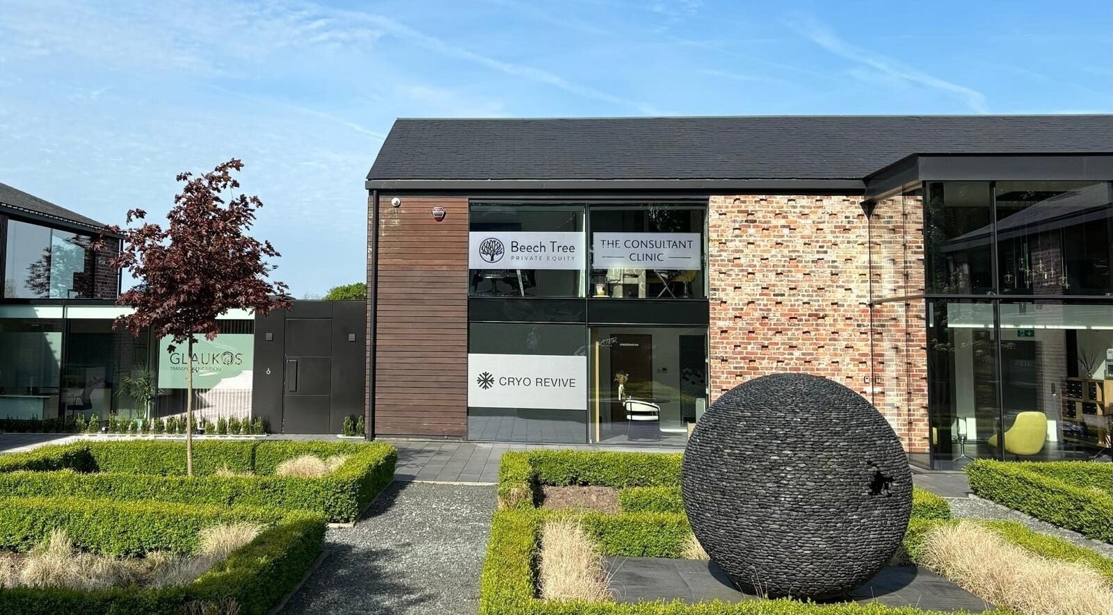 Entrance of Cryo Revive Wilmslow, a modern wellness center in Wilmslow, England, GB, showcasing contemporary architecture.