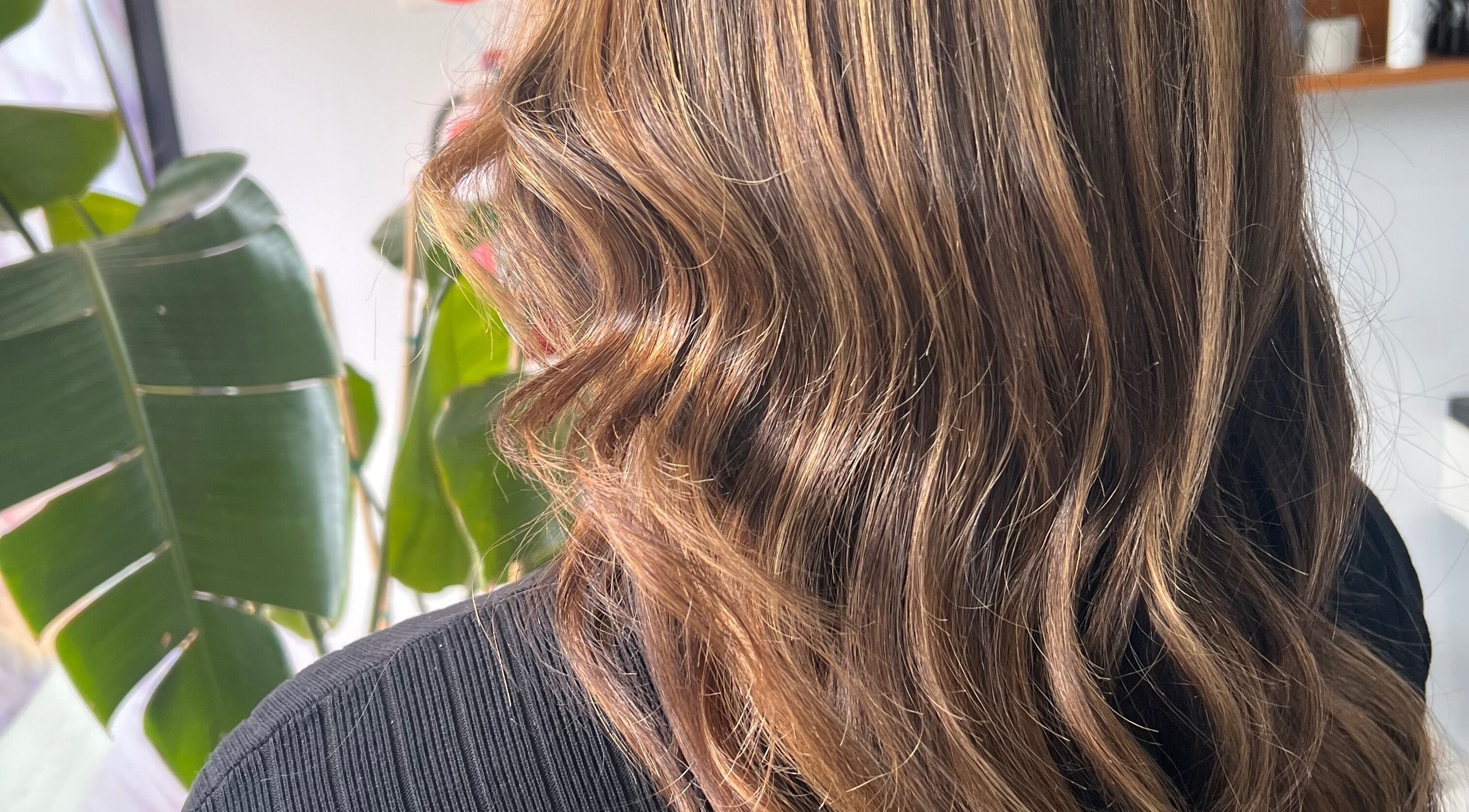 Close-up of wavy, highlighted hair styled at Hair by Megan Hardy, Melbourne, Victoria, AU.