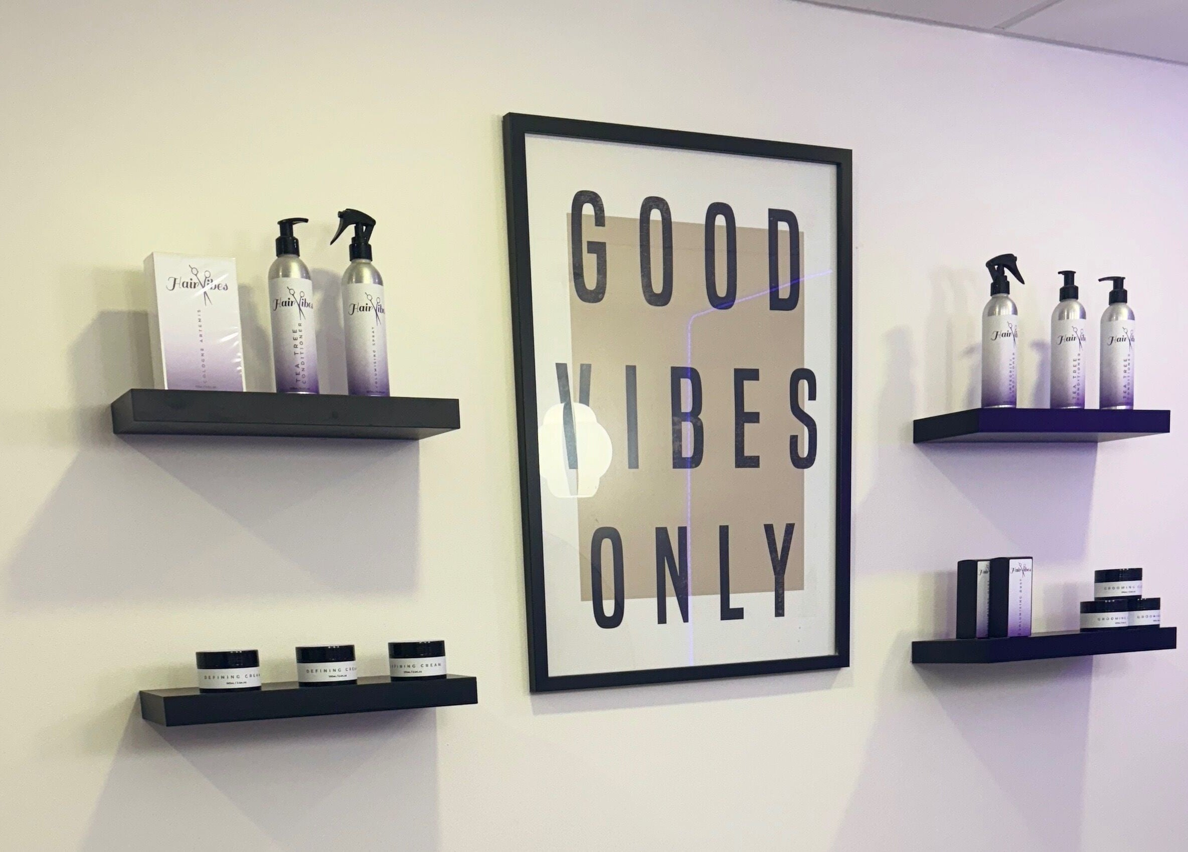 Stylish product display at Hairvibes in Hazlemere, England, GB with 'Good Vibes Only' sign.
