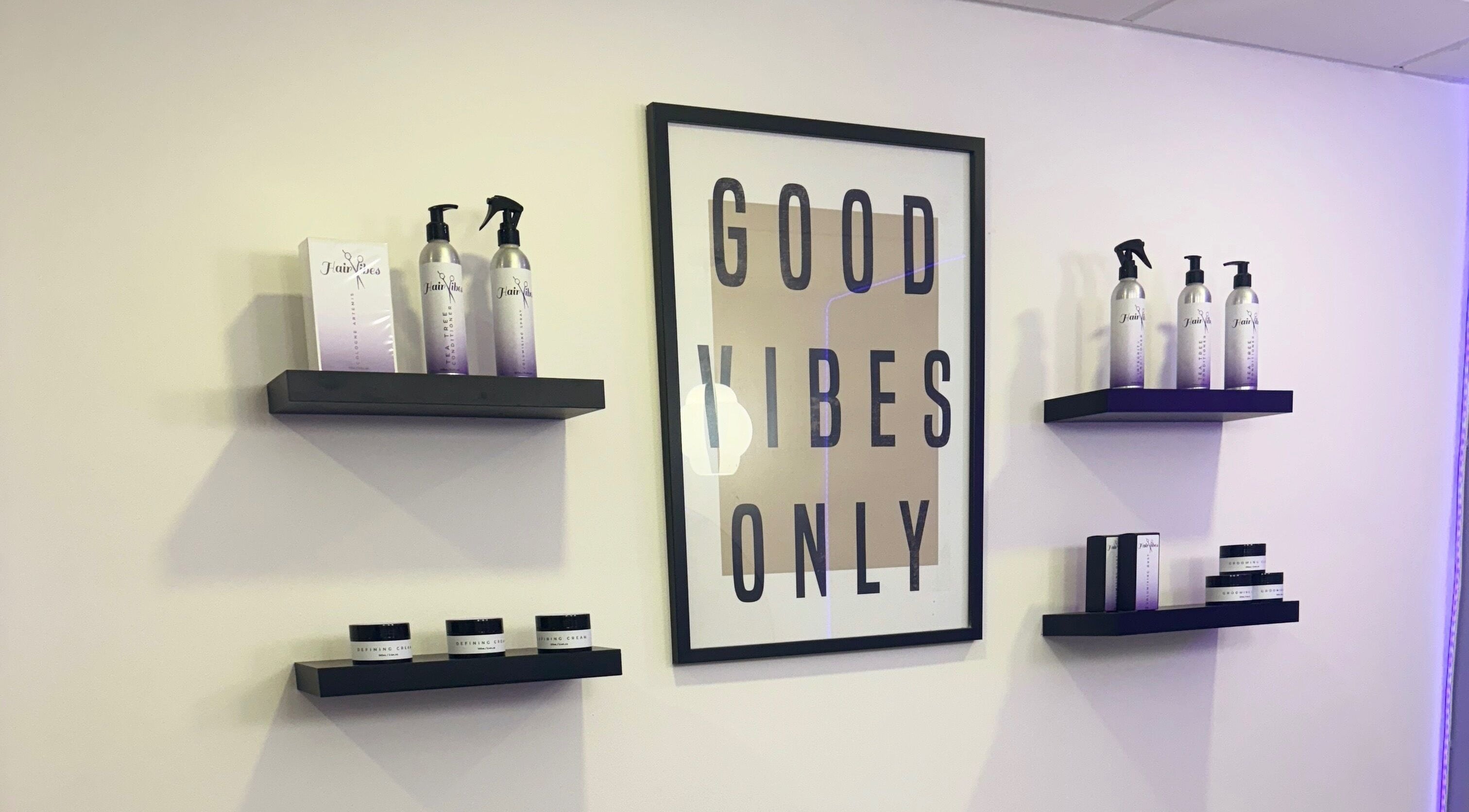 Stylish product display at Hairvibes in Hazlemere, England, GB with 'Good Vibes Only' sign.