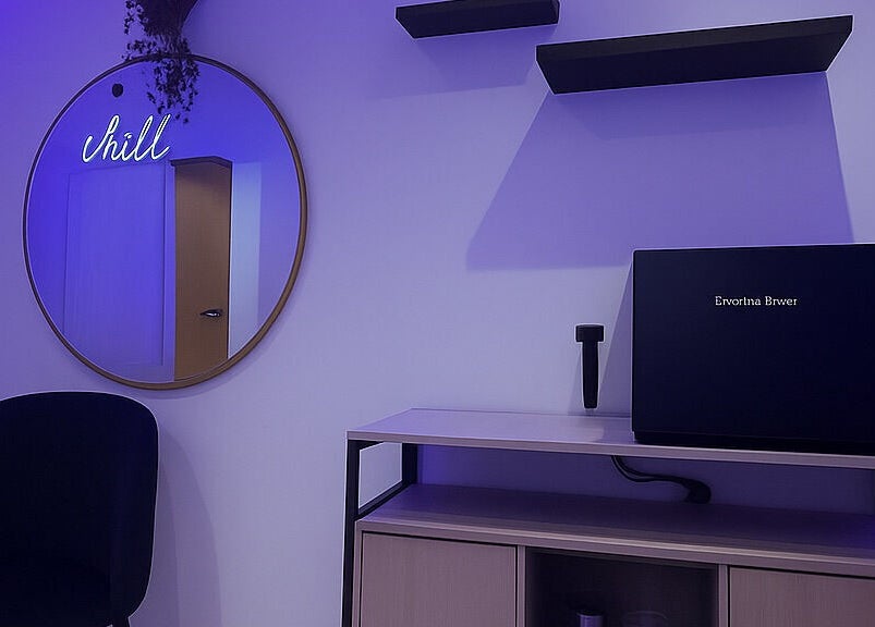 Relaxing room at Hairvibes, Hazlemere, England, GB with stylish decor and ambient lighting.