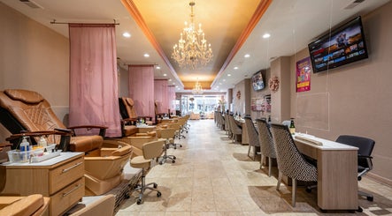 Luxurious interior of Fresh Nails & Spa in Glen Ellyn, Illinois, US with plush pedicure chairs and chandeliers.