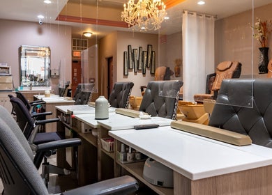Interior of Fresh Nails & Spa, Glen Ellyn, Illinois, US, featuring elegant nail stations and plush chairs.