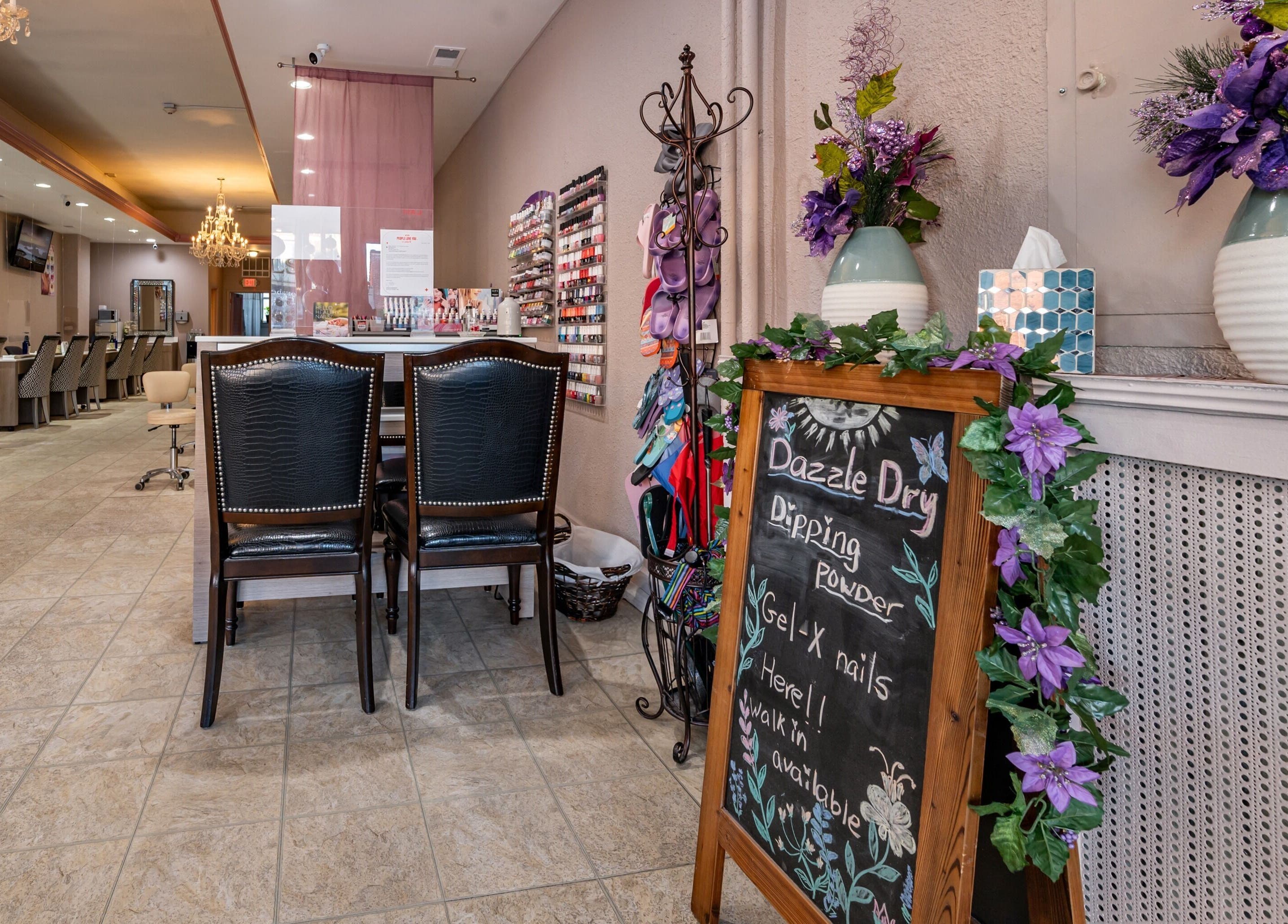 Chic interior of Fresh Nails & Spa in Glen Ellyn, Illinois, US, showcasing stylish seating and floral decor.