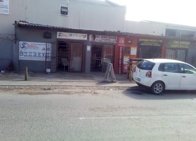 G&L Hair Salon and Nails storefront in Cape Town, Western Cape, ZA, with a white car parked in front.