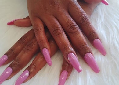Elegant pink manicured nails at G&L Hair Salon and Nails, Cape Town, Western Cape, ZA, on a white surface.
