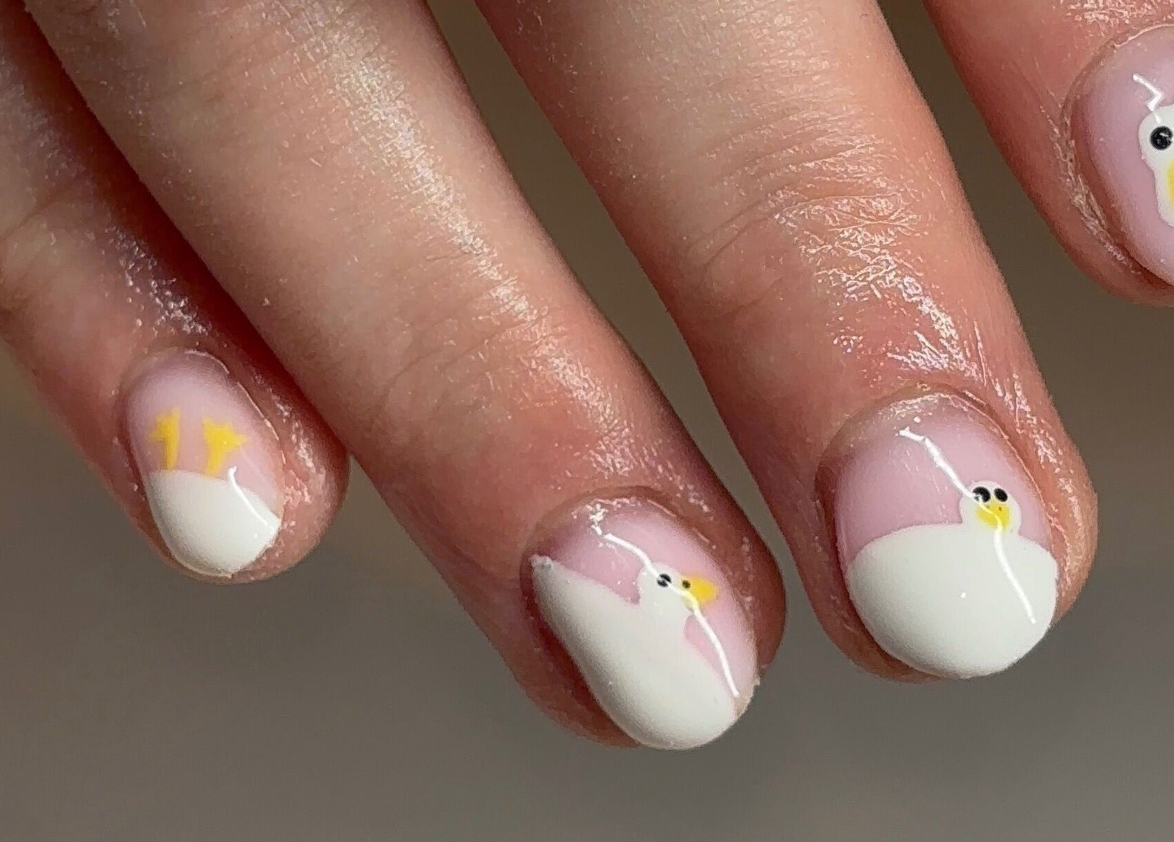 Close-up of swan-themed nail art by Gels by Elise, Forres, GB.