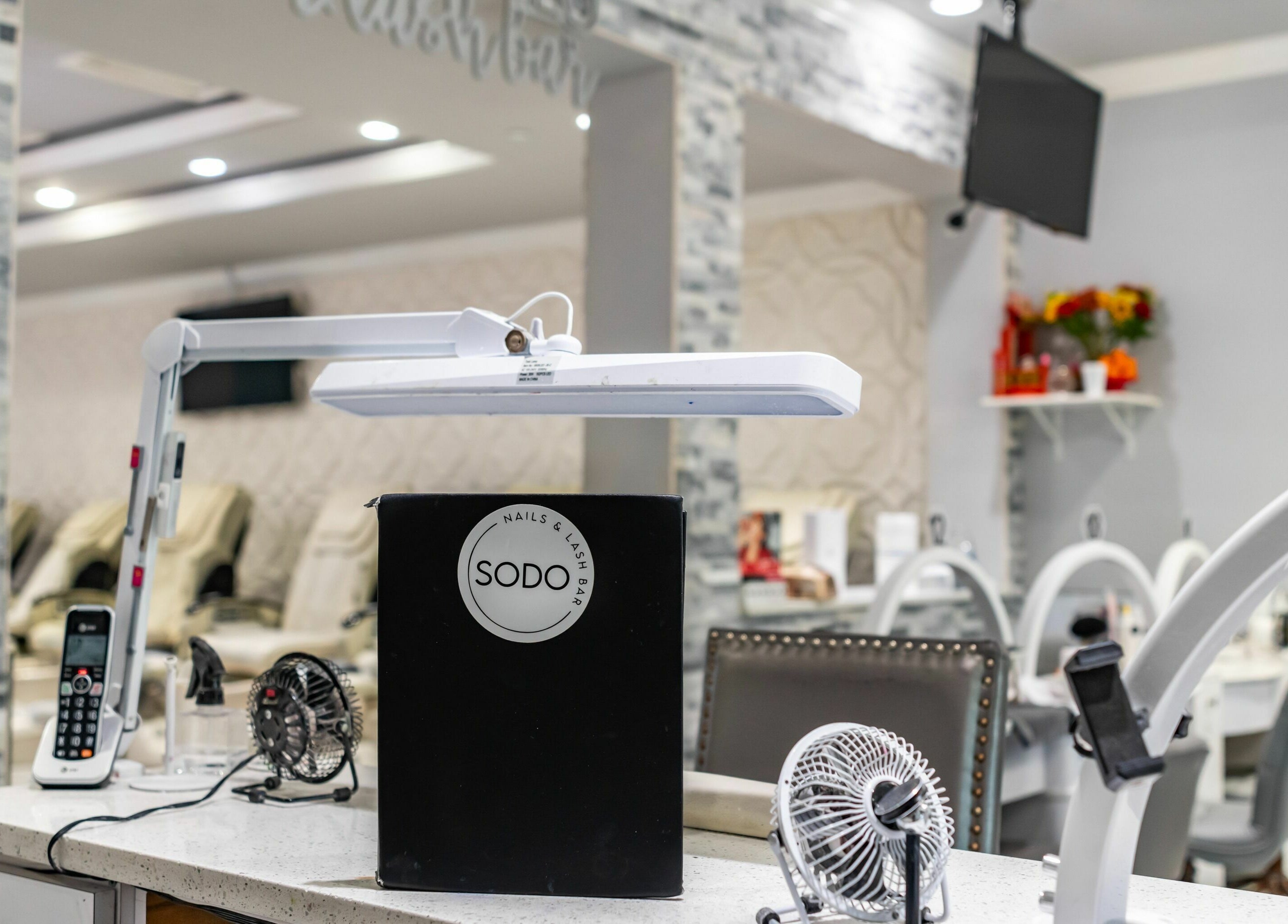 Modern manicure setup at SODO Nails & Lash Bar, Orlando, Florida, US, showcasing sleek styling and elegance.