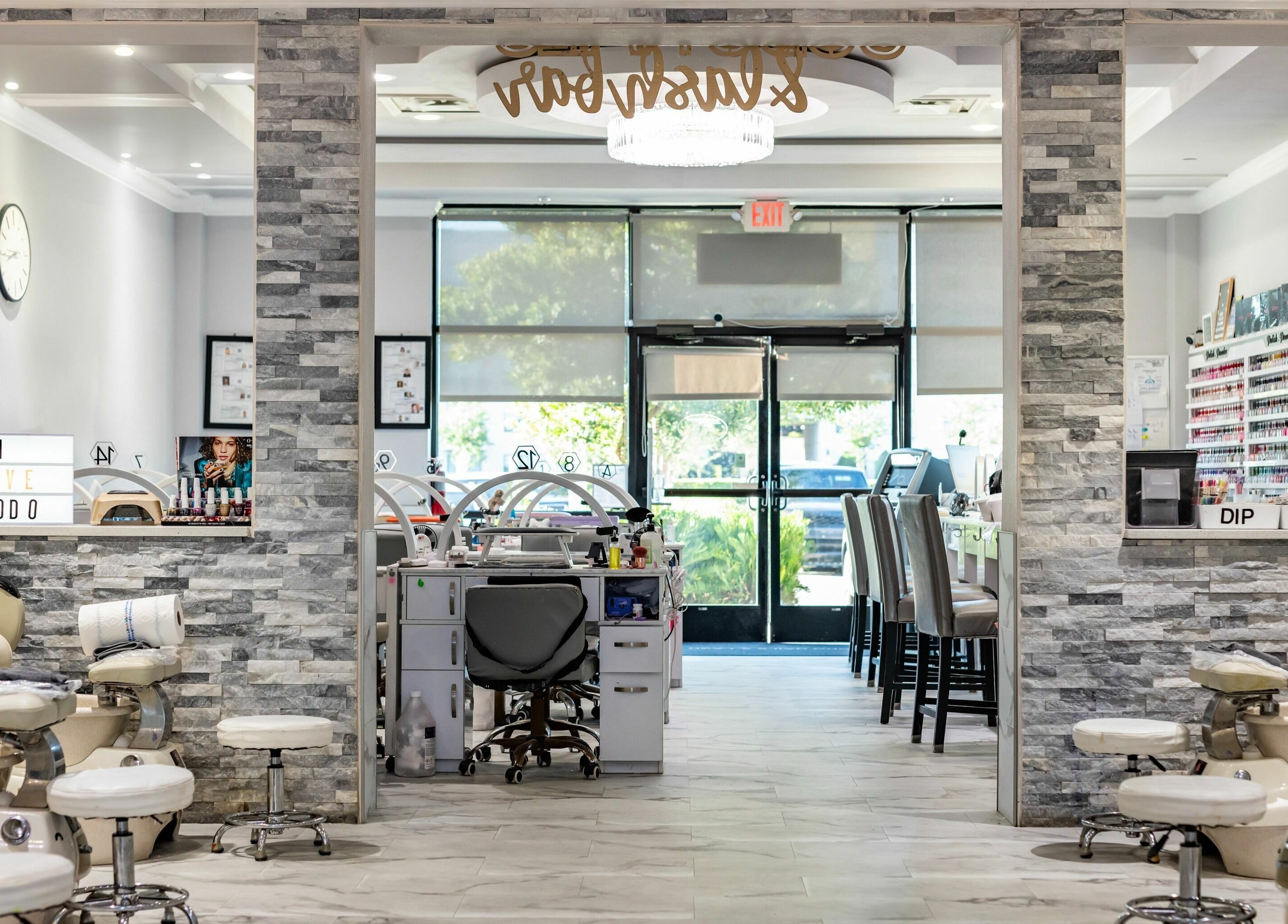 Interior of SODO Nails & Lash Bar in Orlando, Florida, US showcasing sleek nail stations and modern decor.