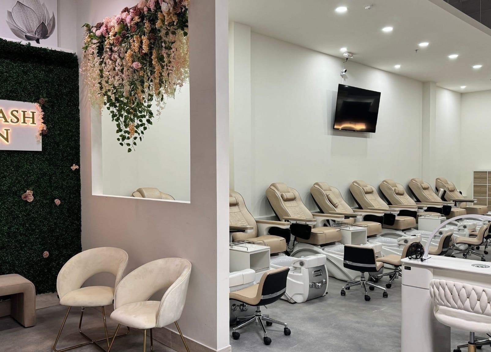 Modern interior of Nails and Lash Garden, Winter Garden, Florida with luxurious seating and floral decor.