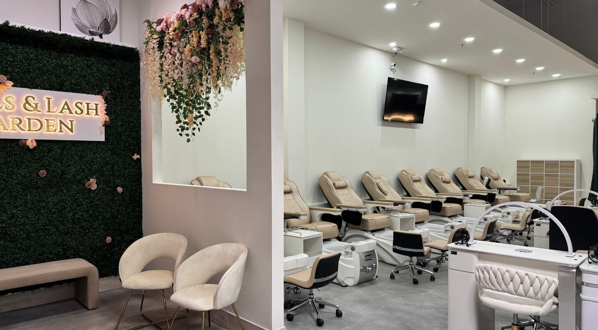 Modern interior of Nails and Lash Garden, Winter Garden, Florida with luxurious seating and floral decor.