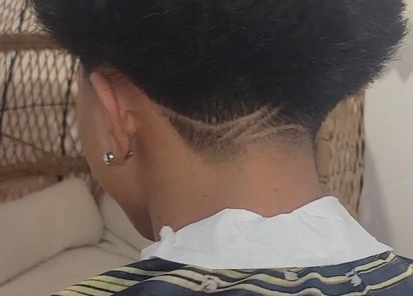 Stylish and modern undercut hairstyle showcased at VINCE'S CHOPS in Montréal, Québec, CA.