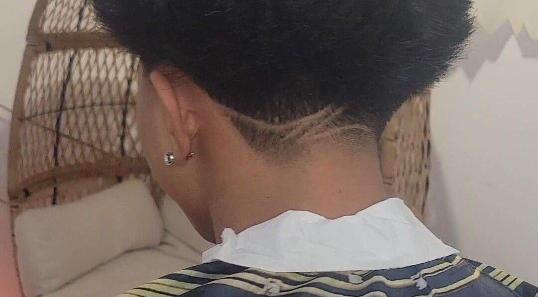 Stylish and modern undercut hairstyle showcased at VINCE'S CHOPS in Montréal, Québec, CA.