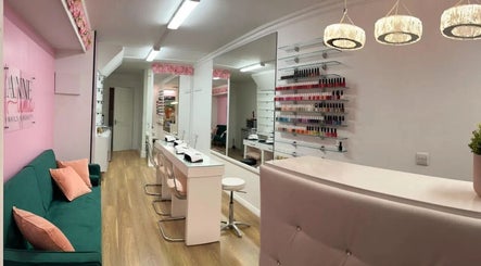 Interior of Anne Lima Nails Beauty in Kildare, IE featuring pink and green decor and a nail polish display.