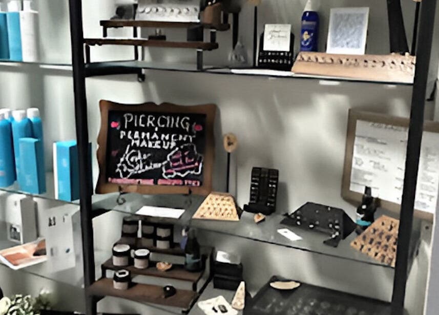 K. Tabone Tattoo's product display and services board in Rochester, New York, US.