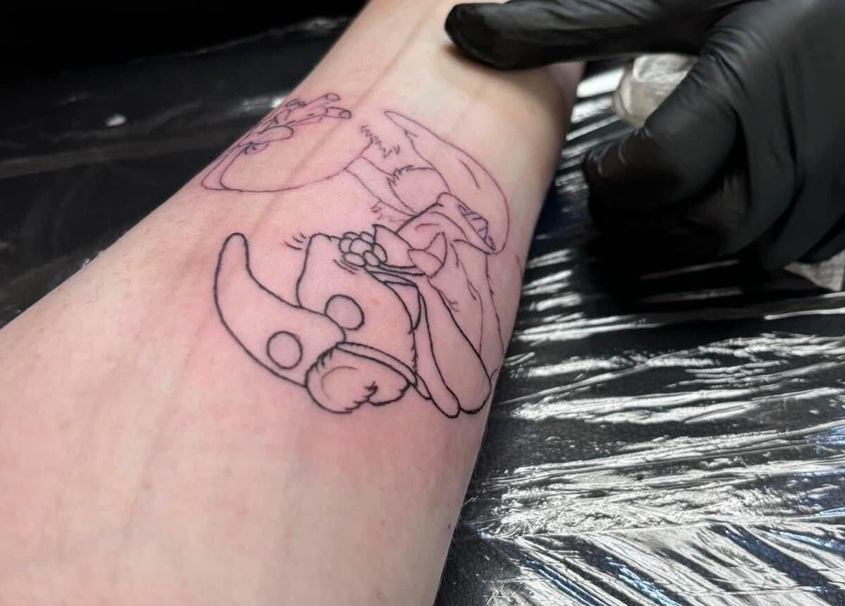 Tattoo in progress at K. Tabone Tattoo, showcasing intricate line art, Rochester, New York, US.