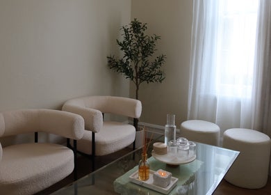 Cozy seating area at The Head Spa Perth, South Perth, Western Australia, AU with soft chairs and ambient lighting.