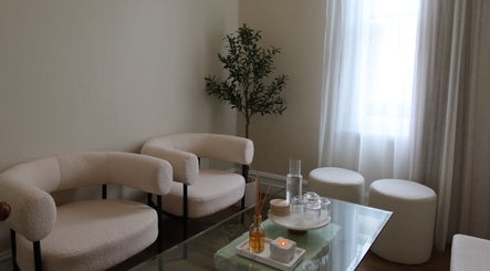Cozy seating area at The Head Spa Perth, South Perth, Western Australia, AU with soft chairs and ambient lighting.