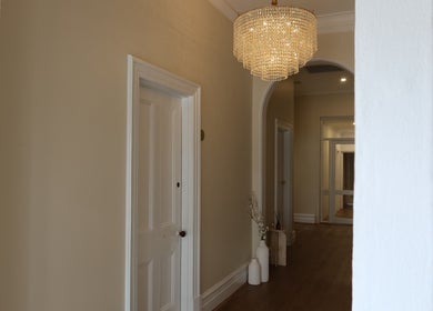 Chic entrance at The Head Spa Perth, South Perth, Western Australia, AU with a stunning chandelier.