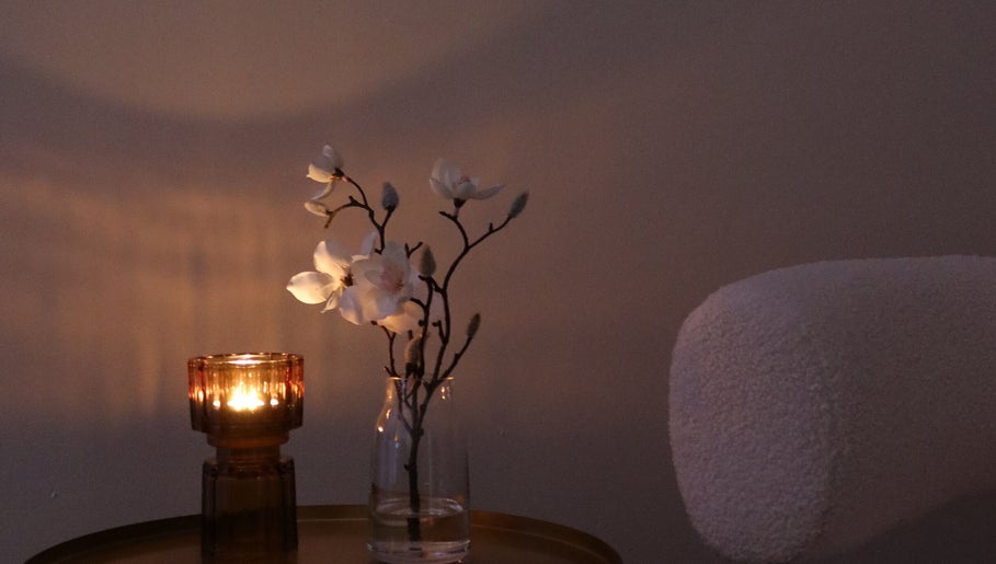 Candlelit floral arrangement at The Head Spa Perth, South Perth, Western Australia, AU for a tranquil ambiance.